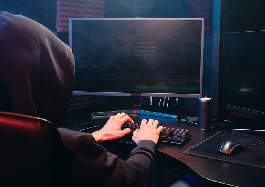 Cybersecurity professional monitoring network security systems in operations center