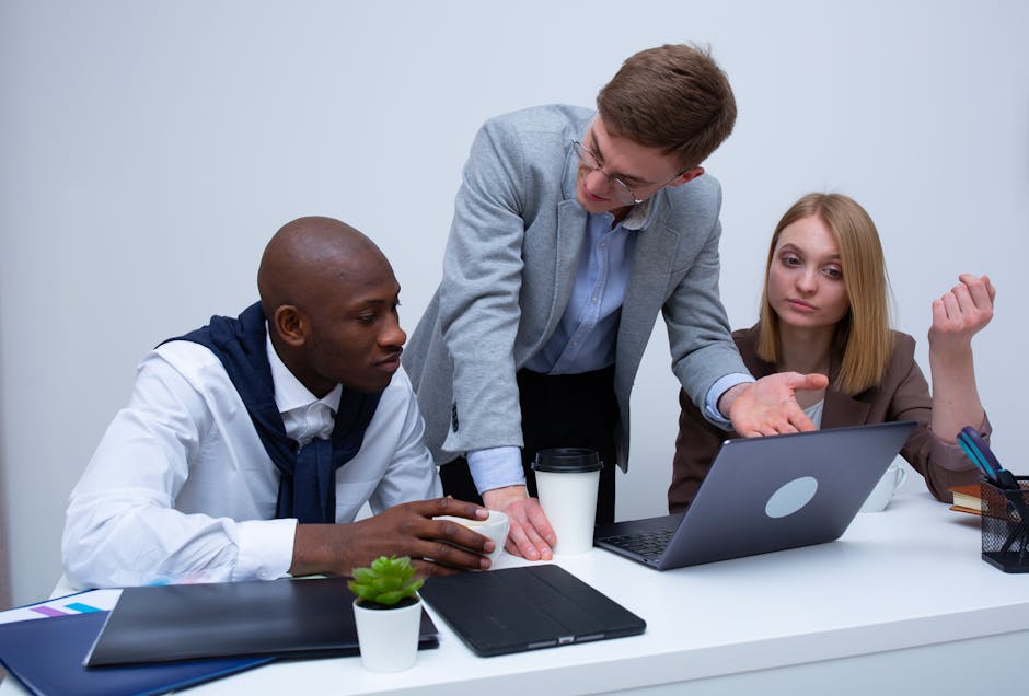 Project management professionals collaborating on strategic planning in modern office setting